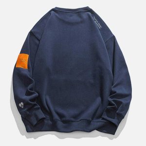youthful orange labeled sweatshirt   trendy streetwear gem 2092